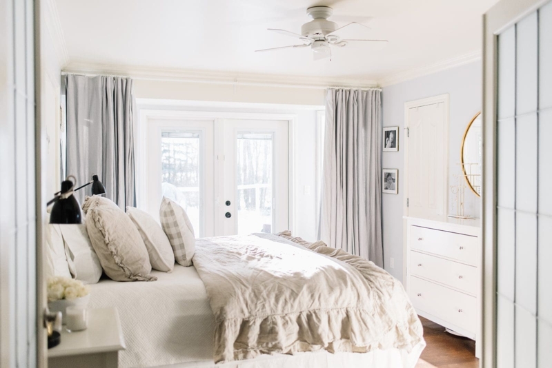 Bright Neutral Bedroom Layout with Ruffled Linens and French Doors