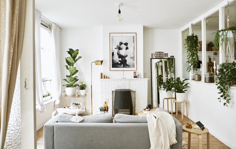 Bright Scandinavian Living Room with White Brick Fireplace and Plants