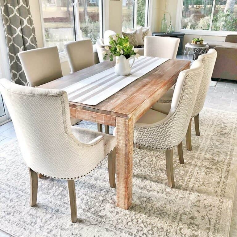 Bright Sunroom Dining Room with Diamond Pattern Upholstery