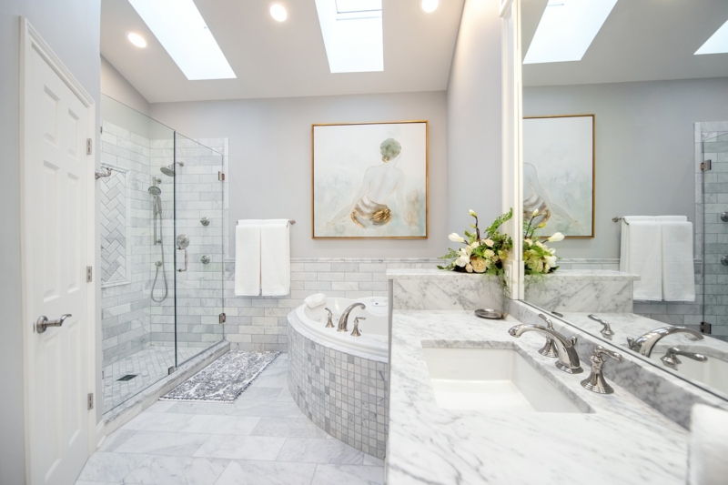 Bright Transitional Master Bath with Skylights and Corner Soaking Tub