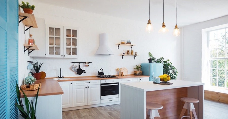 Bright White Kitchen Layout with Blue Retro Fridge