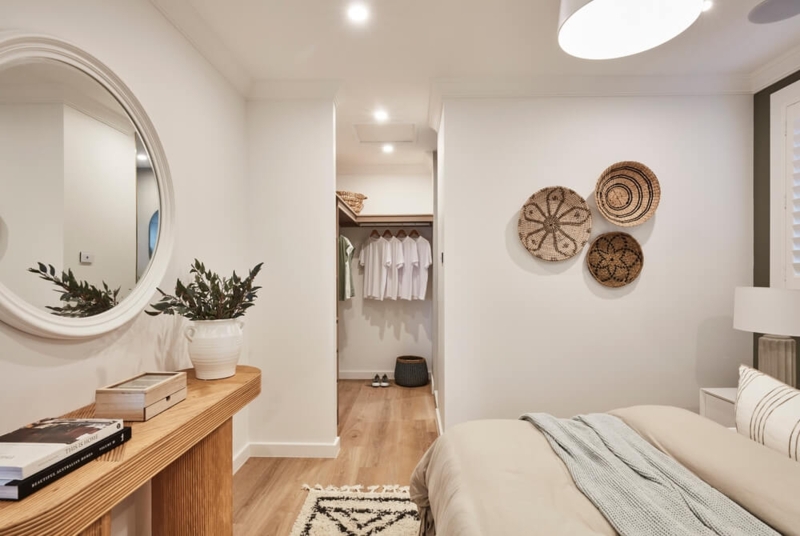Built In Closet System with Fluted Wood Console and Woven Wall Art