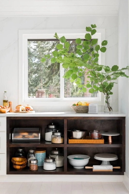 Built-In Dark Wood Open Shelving Under Kitchen Window