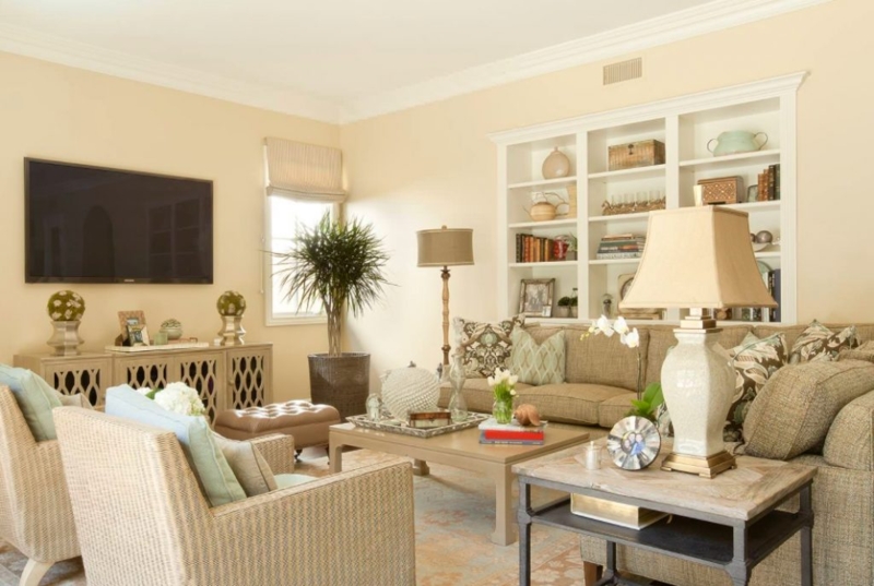 Built-In Shelving and Woven Accent Chairs in Transitional Room