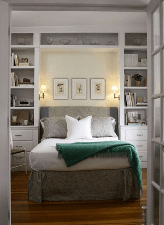 Built-in Shelving Around Bed with Emerald Green Accents and Sconces.
