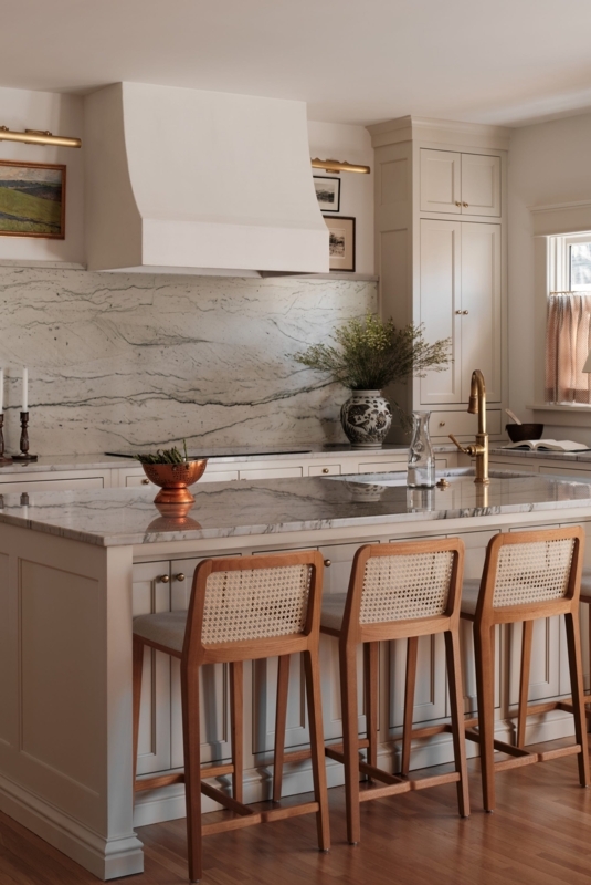 Cane Back Counter Stools in Kitchen with Dramatic Marble Backsplash