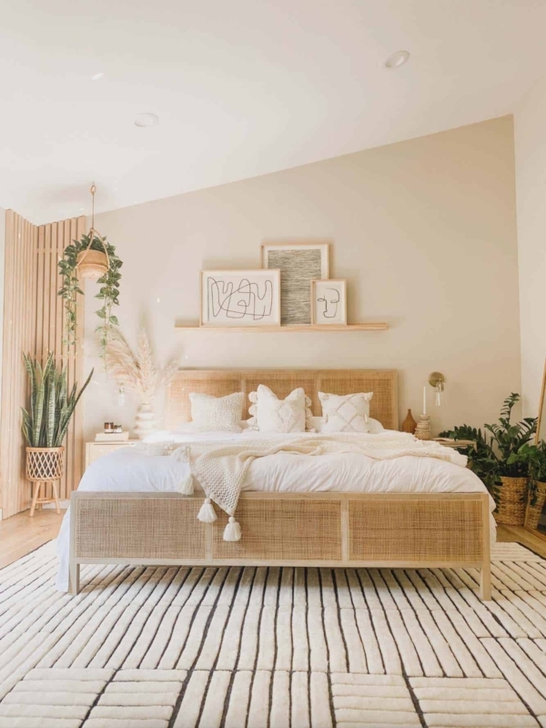 Cane Bed in Boho Scandinavian Bedroom with Striped Rug