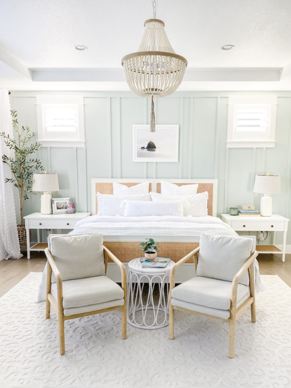 Cane Inlay Bed Frame against Mint Paneled Wall with Chandelier