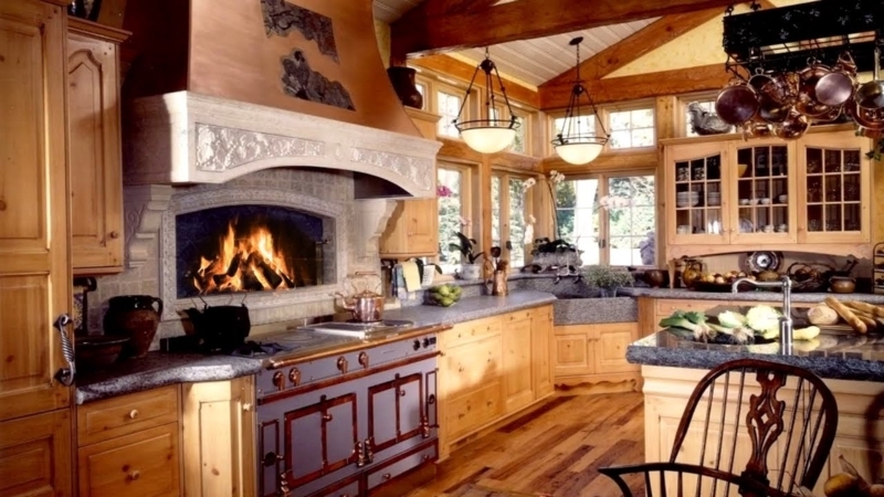 Carved Stone Range Hood with Integrated Fireplace and Copper Cookware