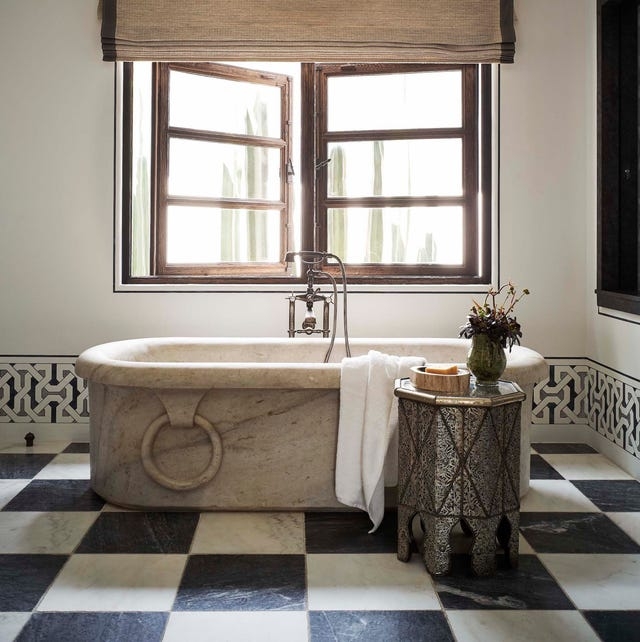 Carved Stone Tub and Black and White Checkered Floor