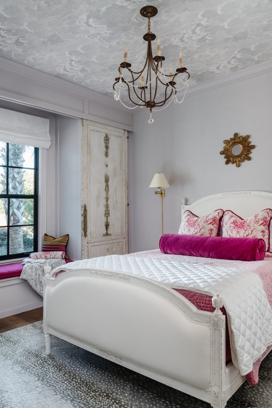 Carved White Bed Frame, Cloud Ceiling Wallpaper, Magenta Velvet Bolster