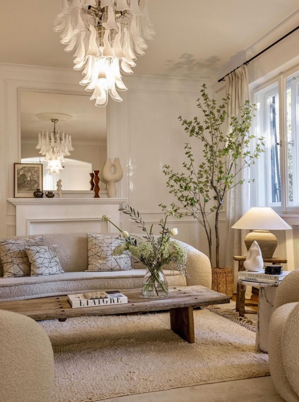 Cascading Glass Chandelier with Curved Boucle Sofa