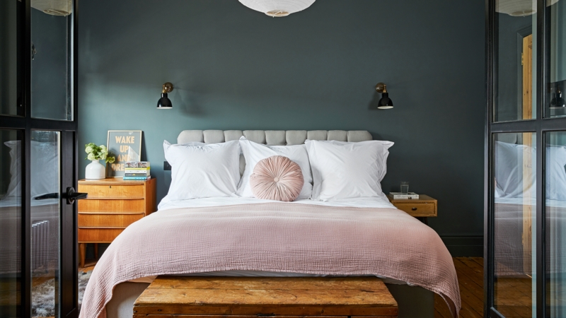 Channel Tufted Bed against Teal Accent Wall & Blush Pink Bedding