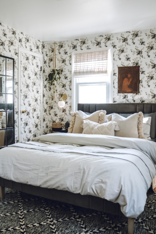Channeled Upholstered Headboard Bed with Floral Wallpaper and Monochrome Contrast