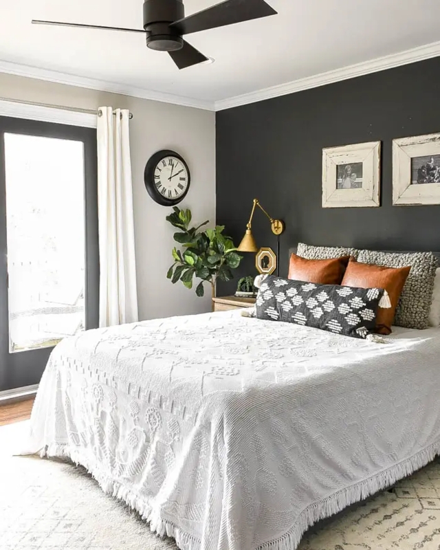 Charcoal Accent Wall with Leather Pillows and Textured Bedding