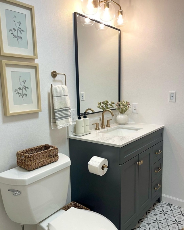 Charcoal Bathroom Vanity with Gold Hardware and Geometric Floor Tiles