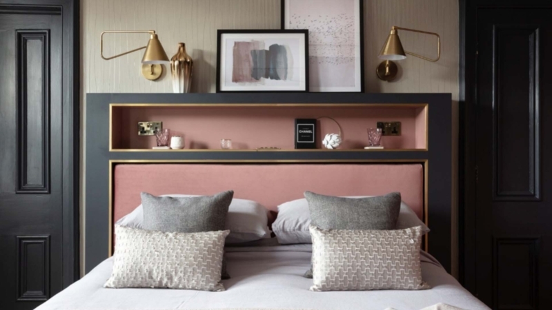 Charcoal Headboard with Recessed Pink Shelf and Brass Wall Sconces