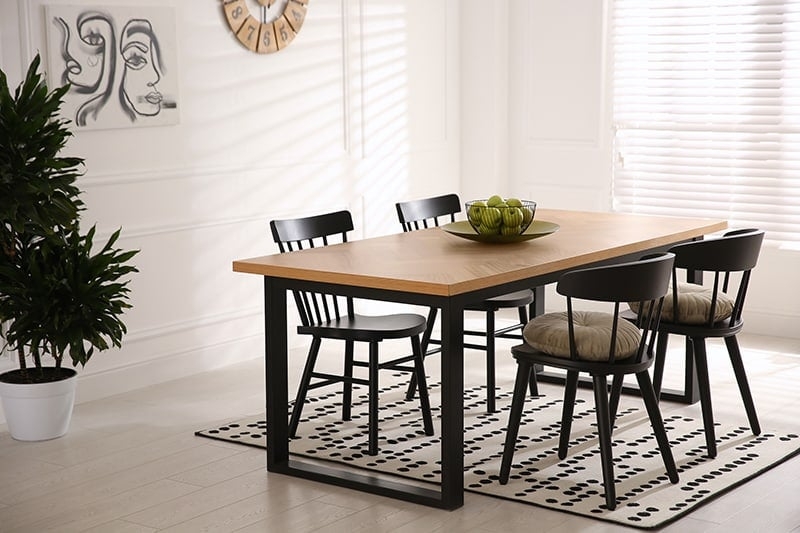 Chevron Wood Dining Table Paired with Dotted Area Rug