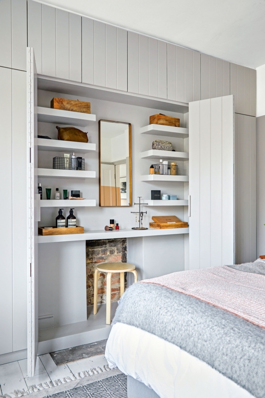 Closet Integrated Makeup Vanity with Exposed Brick Detail