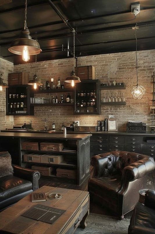 Club Chairs in Moody Mancave Lounge Area with Exposed Brick Bar Wall