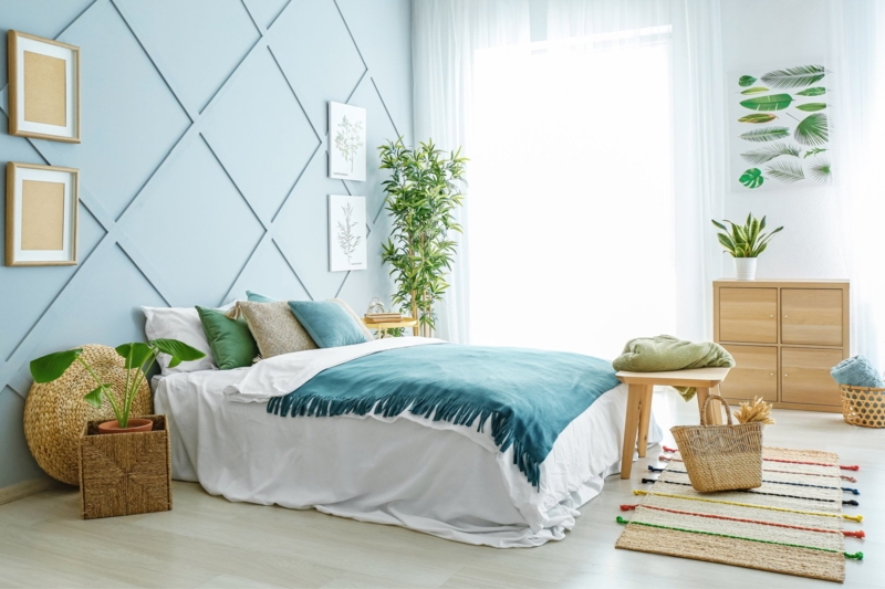 Coastal Bedroom featuring Light Blue Lattice Accent Wall