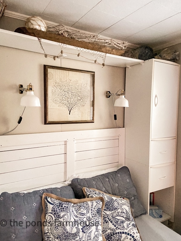 Coastal Bedroom Storage Ideas With Slatted Headboard And Sconces