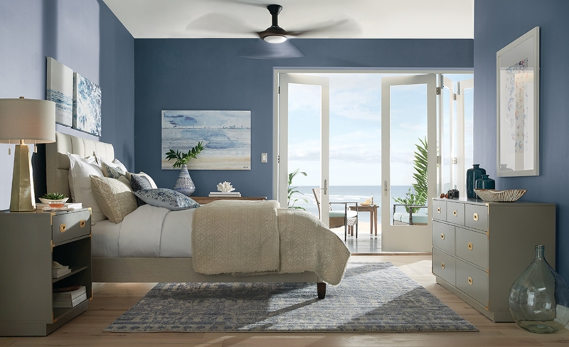Coastal Bedroom with Ocean View French Doors and Navy Blue Walls