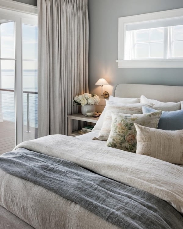 Coastal Bedroom with Water View and Layered Neutrals