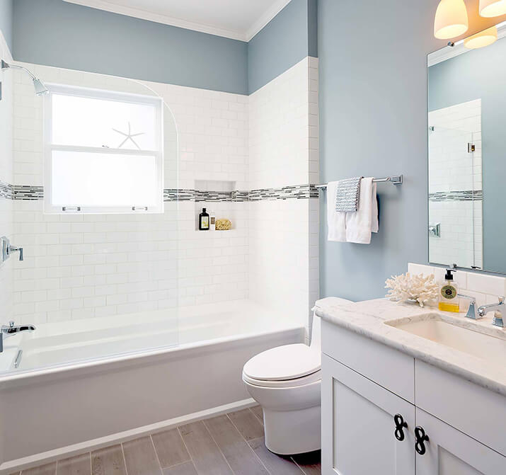 Coastal Blue Guest Bathroom with White Subway Tile and Mosaic Accent