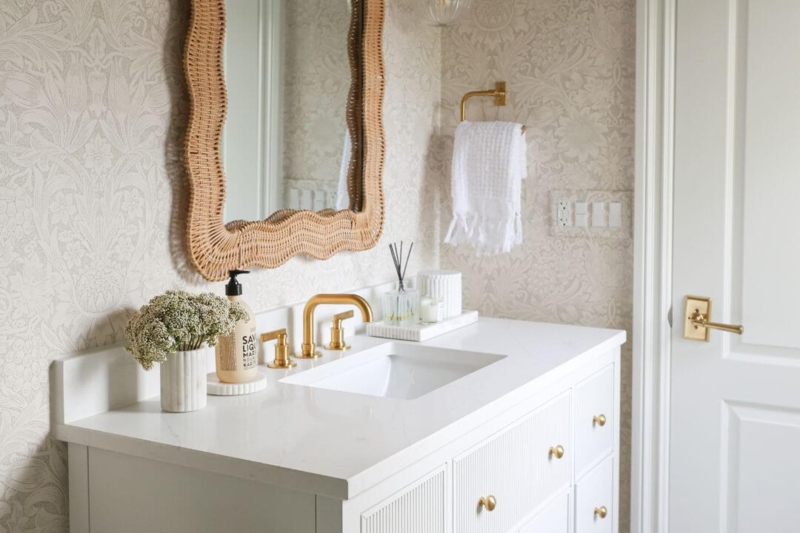Coastal Chic Bathroom: White Fluted Vanity and Wavy Rattan Mirror
