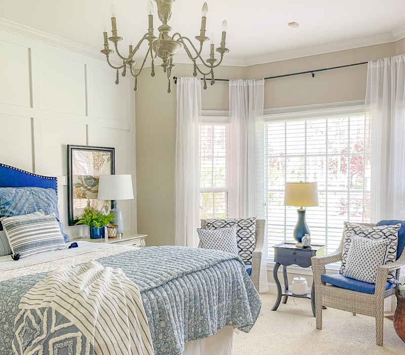 Coastal Cottage Bed with White Grid Wall Paneling and Blue Accents
