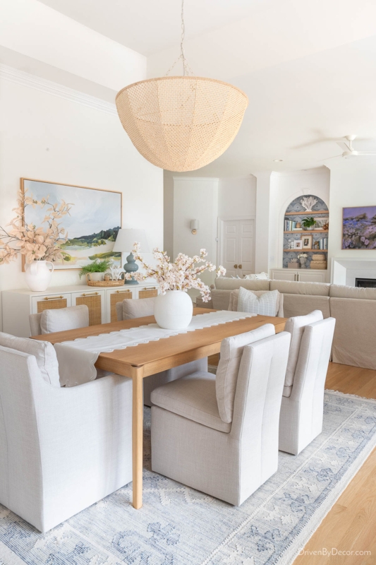 Coastal Dining Room with Oversized Woven Pendant and Blue Rug