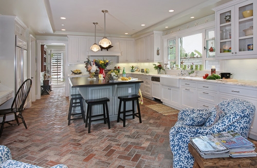 Coastal Farmhouse Kitchen with Herringbone Brick Floor and Blue-Gray Island