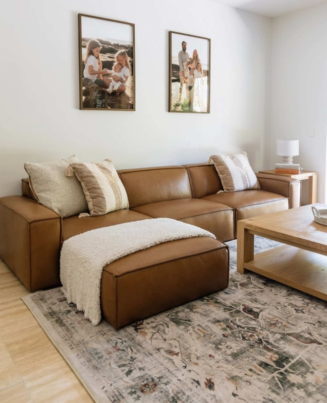 Cognac Leather Sectional Styling: Low Profile Base and Distressed Rug