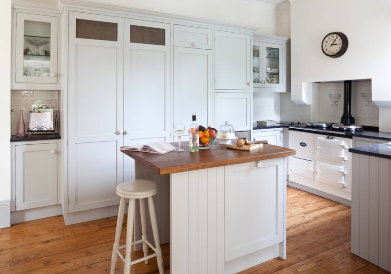 Compact Black Island with Butcher Block Top and Seating