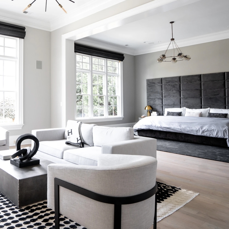 Contemporary Bedroom with Upholstered Grid Wall and Layered Area Rugs