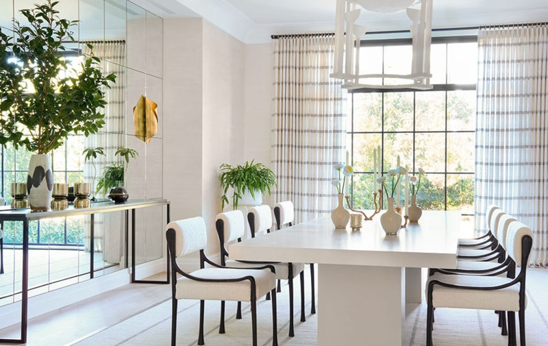 Contemporary Dining Room with Vertical Striped Drapery and Mirrored Wall