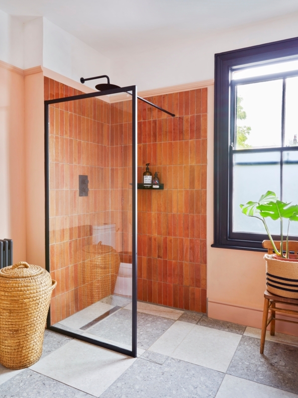 Contemporary Doorless Walk-In Shower: Orange Vertical Tiles & Black Frame