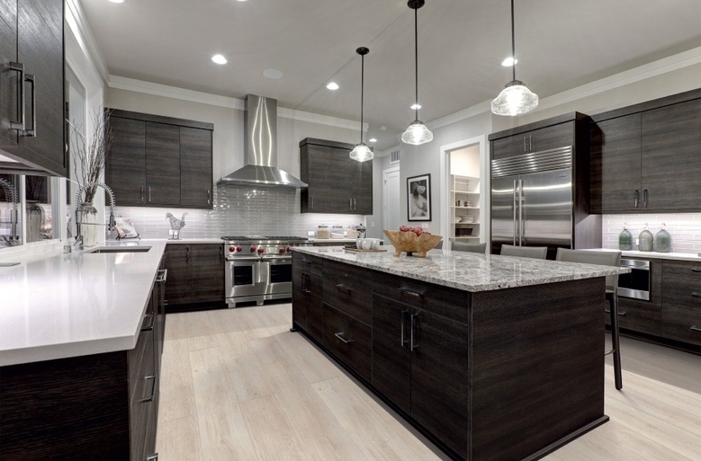 Contemporary Kitchen: Light Oak Look Floors and Marble Top Island