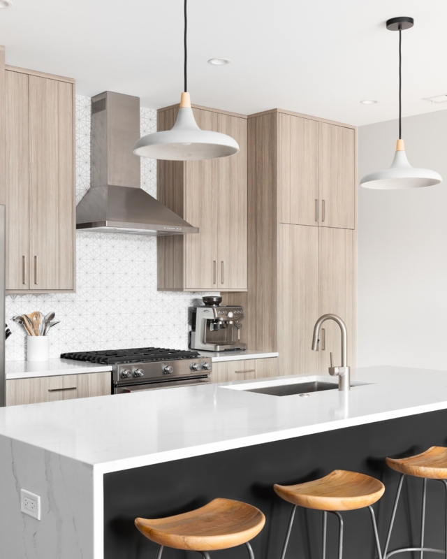 Contemporary Kitchen with Black Island Base and Waterfall Edge