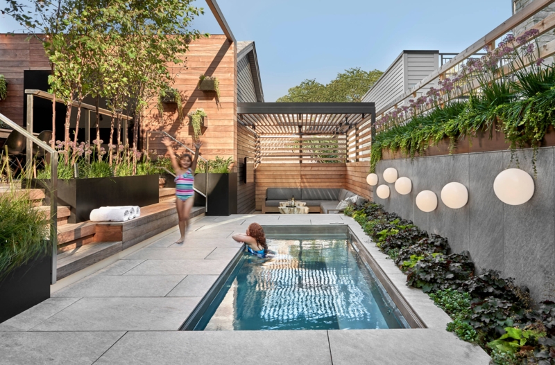 Contemporary Lap Pool with Wood Cladding and Orb Lights