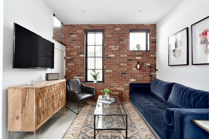 Contemporary Living Room: Exposed Brick & Navy Blue Velvet Sofa Ideas
