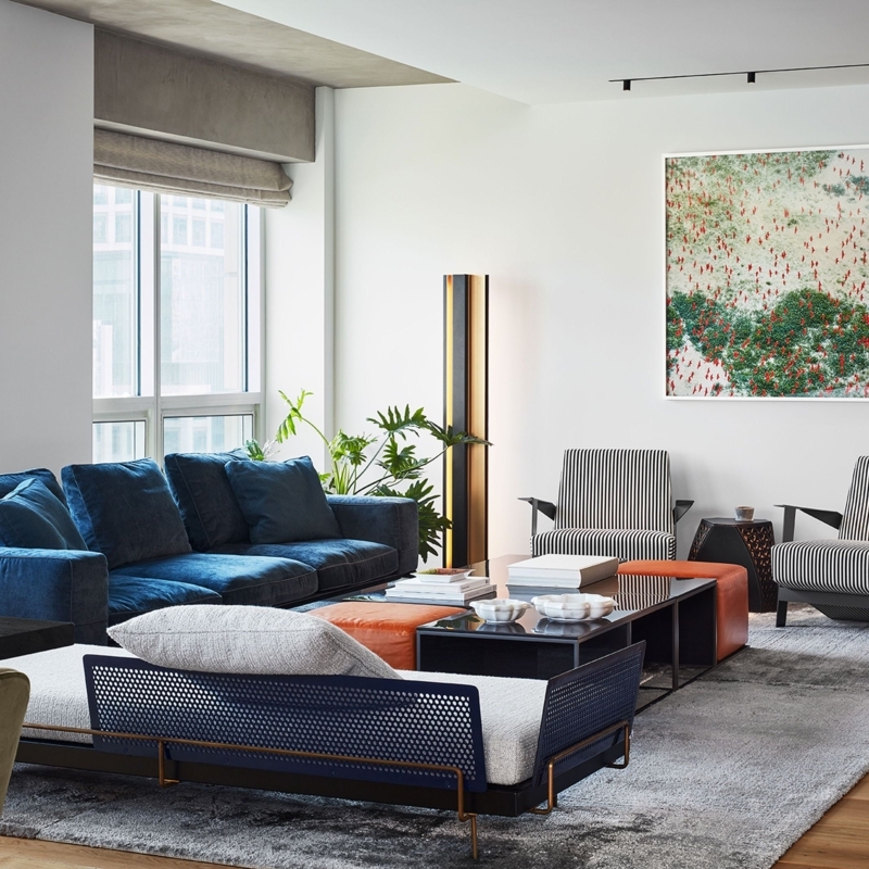 Contemporary Sofa with Perforated Metal Daybed and Orange Accents