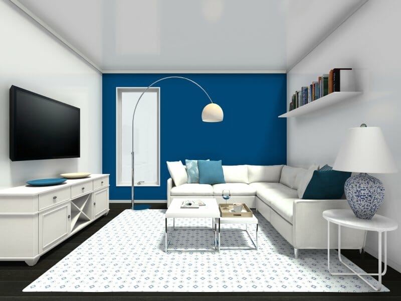 Contemporary White Sectional with Blue Accent Wall & Arched Lamp