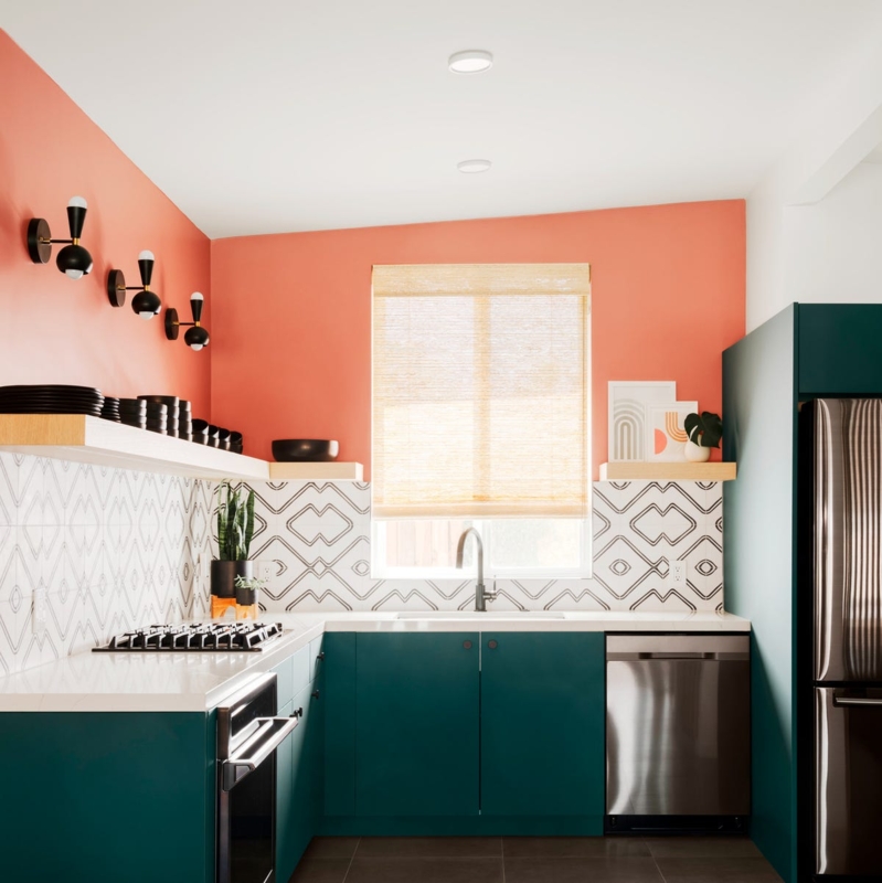 Coral Walls and Teal Cabinets with Floating Shelves