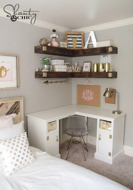 Corner Floating Shelves above White L-Shaped Desk with Gold Accents