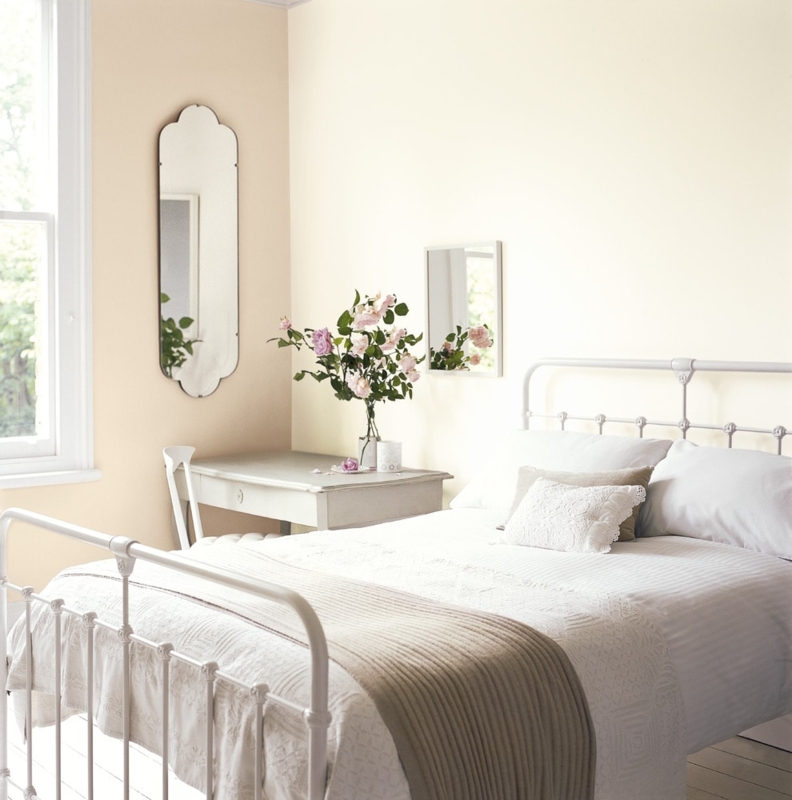 Cottage Bedroom with White Metal Bed and Arched Scalloped Mirror