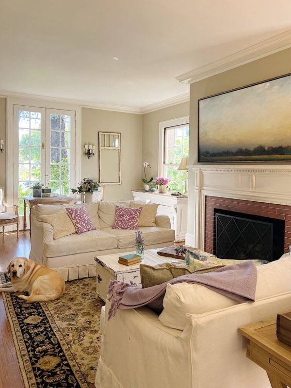 Cottage Living Room with Skirted Sofa and Brick Fireplace Styling