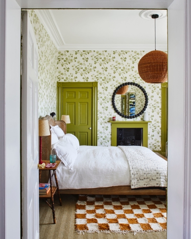 Cottage Style Bedroom with Olive Green Fireplace and Checkered Rug