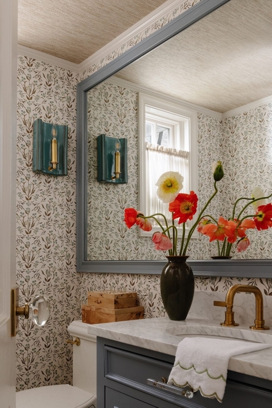 Cottage Style Powder Room with Botanical Wallpaper and Teal Sconces